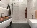 Salle de bain moderne avec murs texturés rappelant la pierre de Bourgogne, double vasque en cuivre, baignoire îlot et douche à l'italienne.